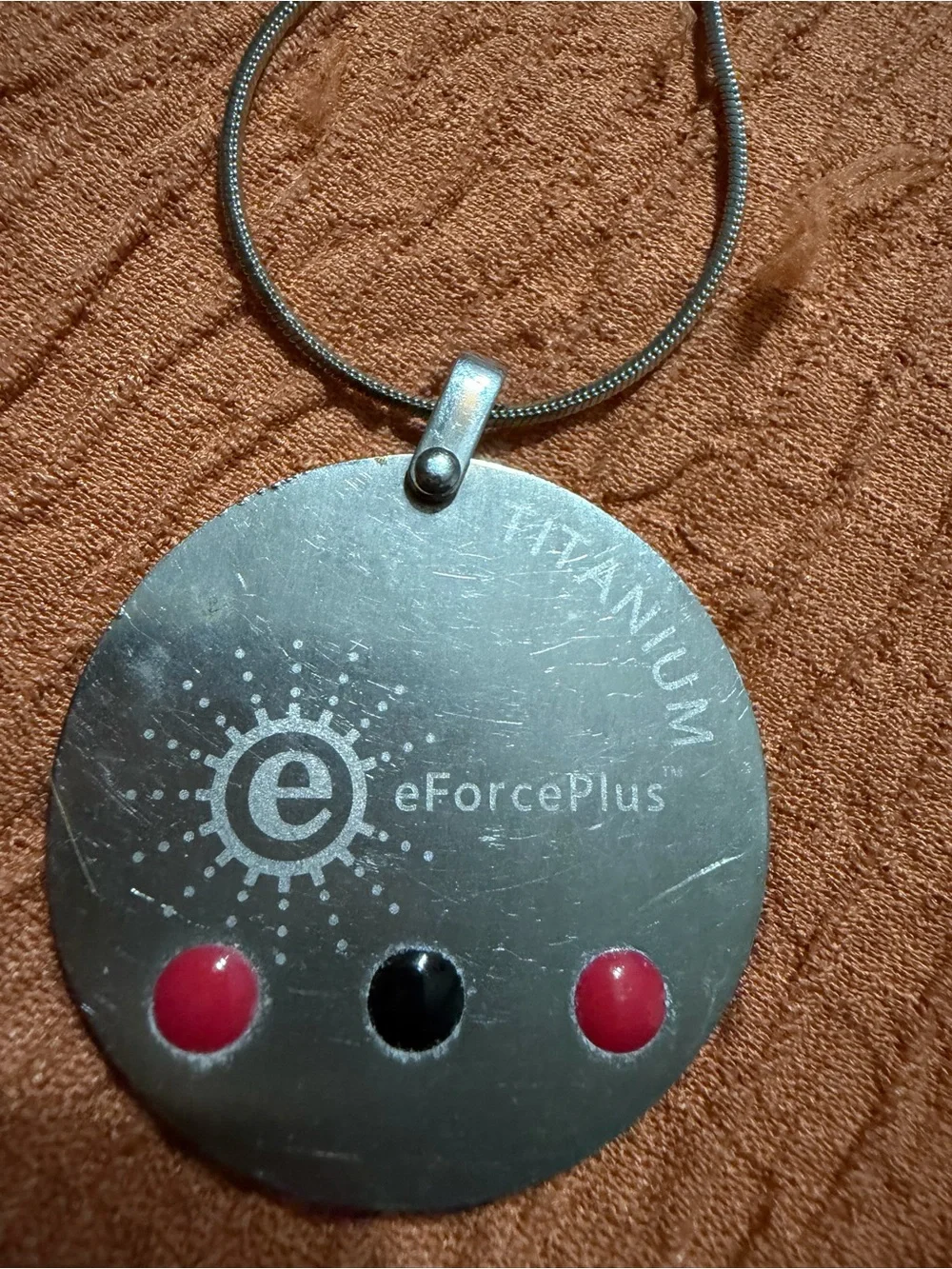 eForcePlus Titanium Round Pendant Necklace in Silver with Pink Accents